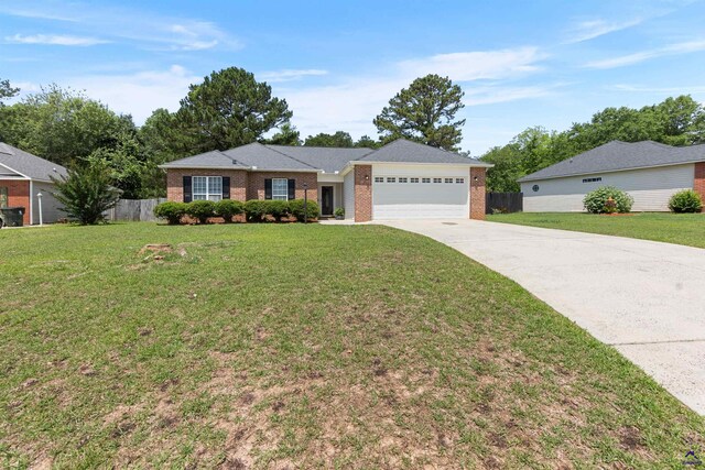 single story home with a garage, concrete driveway, and brick siding