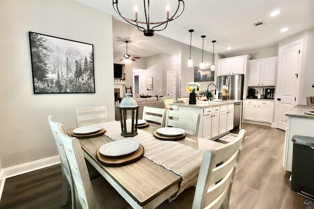 121 Gwendolyn Ave, Perry, GA 31069 - dining area featuring a chandelier, light wood-style floors, recessed lighting, ceiling fan, and baseboards