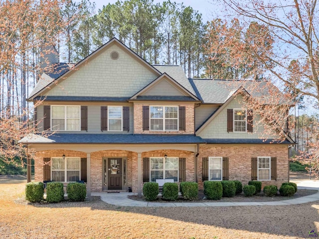 427 Oscar Ct, Mcdonough, GA 30252 - view of front of property featuring a shingled roof, brick siding, and a chimney