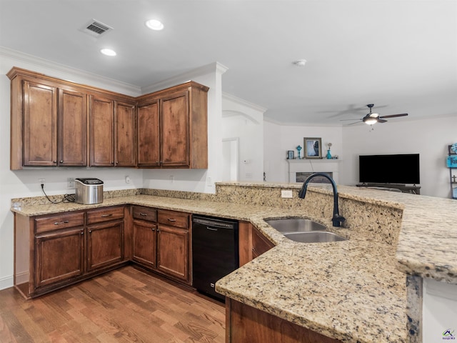 427 Oscar Ct, Mcdonough, GA 30252 - kitchen with a sink, dishwasher, ceiling fan, wood finished floors, and light stone countertops