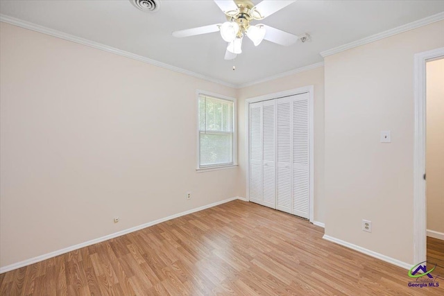 3015 Clairmont Ave, Macon, GA 31204 - unfurnished bedroom with light wood finished floors, baseboards, a closet, ornamental molding, and ceiling fan