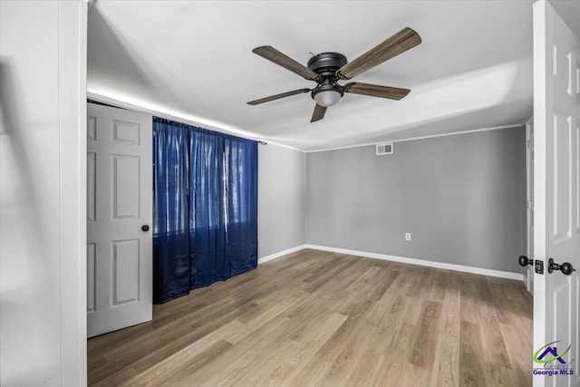 3015 Clairmont Ave, Macon, GA 31204 - spare room featuring a ceiling fan, wood finished floors, and baseboards