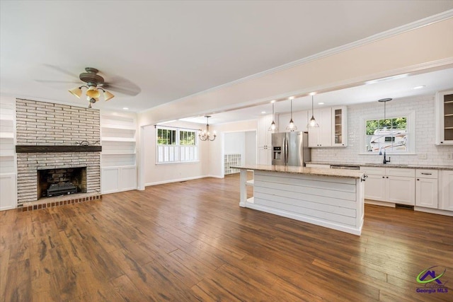 3015 Clairmont Ave, Macon, GA 31204 - kitchen with stainless steel fridge with ice dispenser, a sink, open floor plan, glass insert cabinets, and a ceiling fan