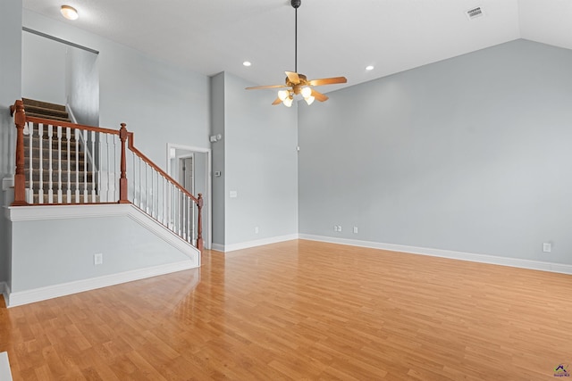 210 Vining Way, Byron, GA 31008 - empty room featuring stairs, light wood finished floors, ceiling fan, baseboards, and vaulted ceiling