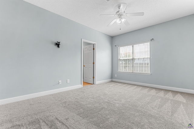210 Vining Way, Byron, GA 31008 - spare room with light colored carpet, a ceiling fan, a textured ceiling, and baseboards