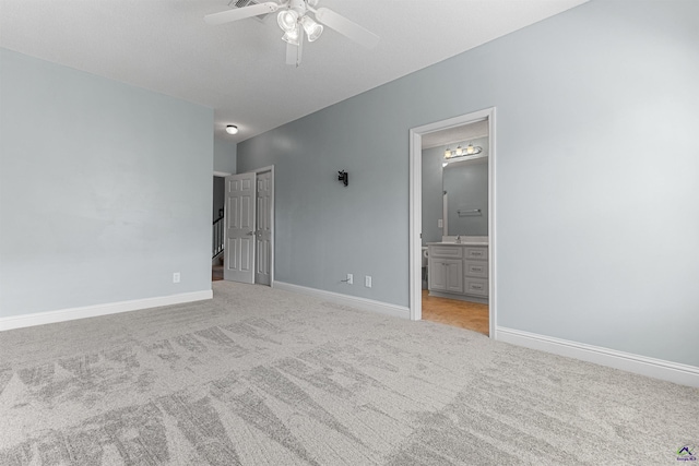 210 Vining Way, Byron, GA 31008 - unfurnished bedroom featuring light carpet, baseboards, and connected bathroom