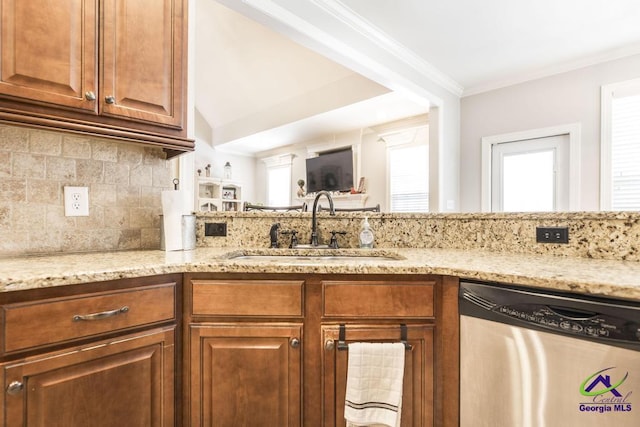 215 Wilson Creek Bnd, Bonaire, GA 31005 - kitchen with stainless steel dishwasher, a sink, light stone counters, decorative backsplash, and crown molding