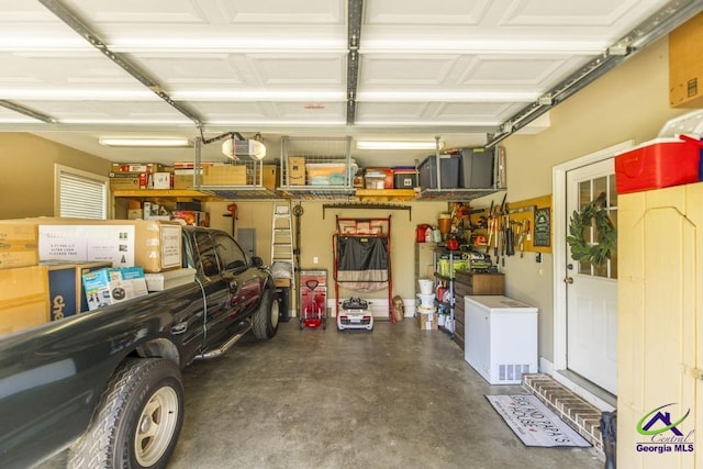 215 Wilson Creek Bnd, Bonaire, GA 31005 - garage with refrigerator and a garage door opener