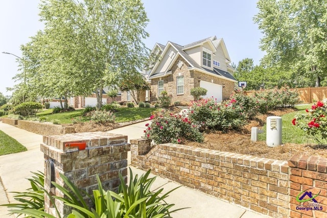 215 Wilson Creek Bnd, Bonaire, GA 31005 - craftsman-style home with brick siding and an attached garage