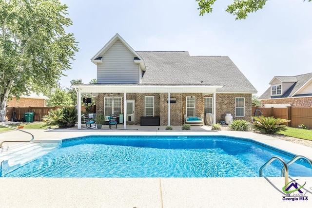 215 Wilson Creek Bnd, Bonaire, GA 31005 - view of swimming pool with a patio area and an outdoor living space