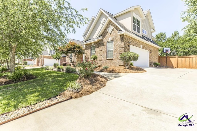 215 Wilson Creek Bnd, Bonaire, GA 31005 - traditional-style home with driveway, a garage, brick siding, and stucco siding
