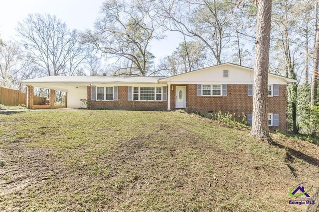 1035 S Pine Knoll Dr, Macon, GA 31204 - single story home with brick siding and a carport