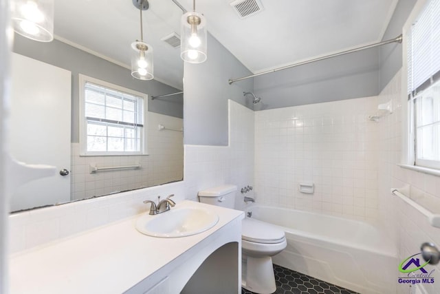 1035 S Pine Knoll Dr, Macon, GA 31204 - full bath with tile walls, toilet, shower / washtub combination, and vanity