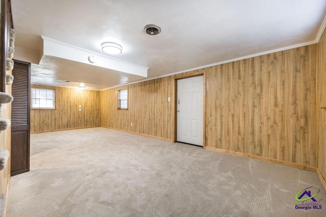 1035 S Pine Knoll Dr, Macon, GA 31204 - basement featuring wooden walls, carpet floors, baseboards, and crown molding