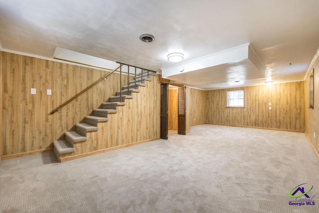 1035 S Pine Knoll Dr, Macon, GA 31204 - below grade area featuring wooden walls, stairs, carpet flooring, and baseboards