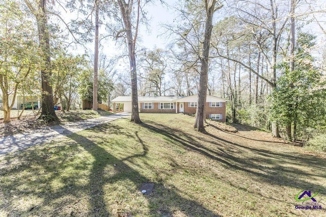 1035 S Pine Knoll Dr, Macon, GA 31204 - ranch-style home featuring concrete driveway and a front lawn