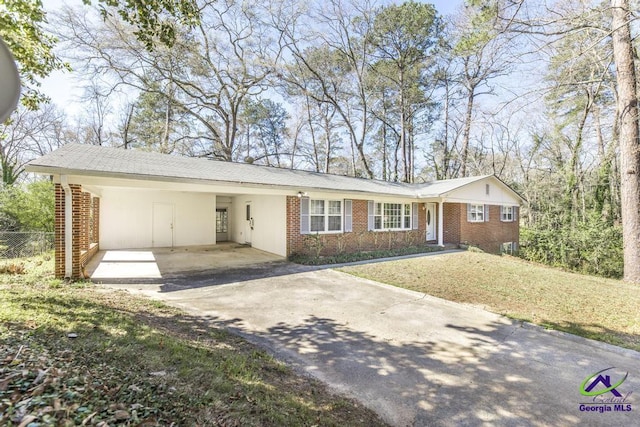 1035 S Pine Knoll Dr, Macon, GA 31204 - ranch-style house with driveway, brick siding, and a carport
