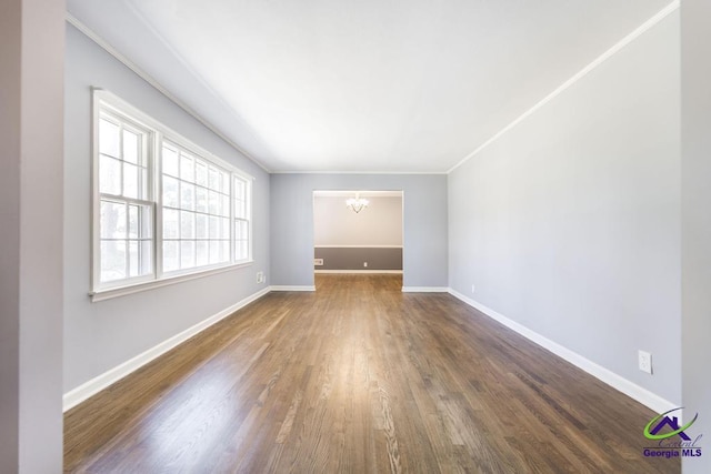 1035 S Pine Knoll Dr, Macon, GA 31204 - unfurnished room with a chandelier, wood finished floors, baseboards, and ornamental molding