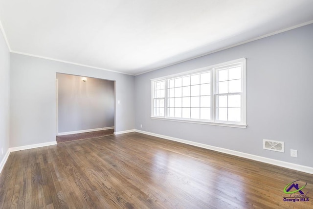 1035 S Pine Knoll Dr, Macon, GA 31204 - empty room with baseboards, ornamental molding, and dark wood-style floors