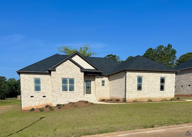 86 Camden Way, Hawkinsville, GA 31036 - view of front facade with a front lawn, brick siding, crawl space, and a shingled roof