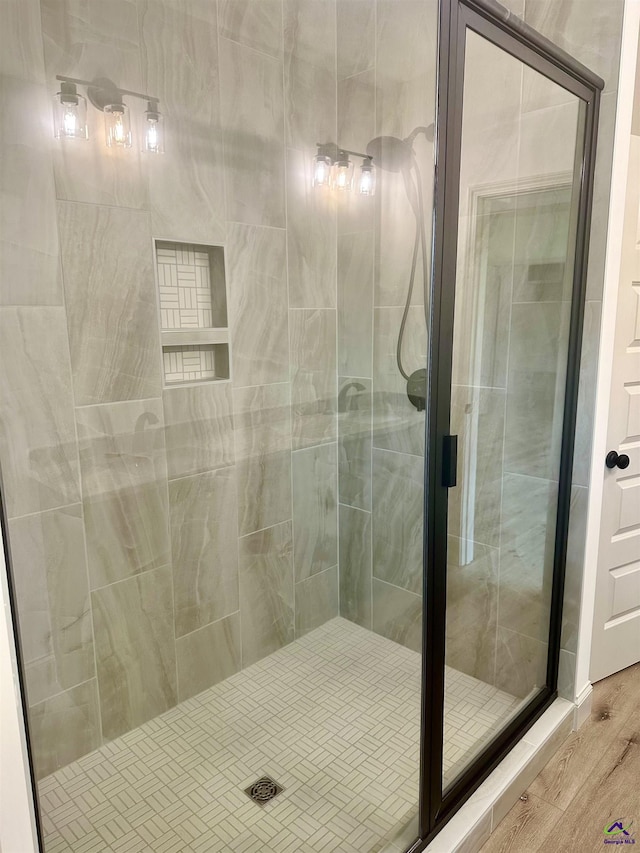 86 Camden Way, Hawkinsville, GA 31036 - bathroom with a stall shower and wood finished floors