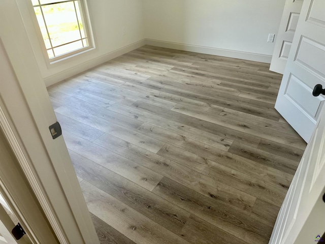 86 Camden Way, Hawkinsville, GA 31036 - empty room with wood finished floors and baseboards