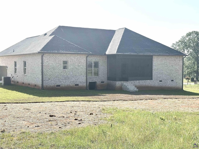 86 Camden Way, Hawkinsville, GA 31036 - rear view of property with crawl space, brick siding, cooling unit, and a yard