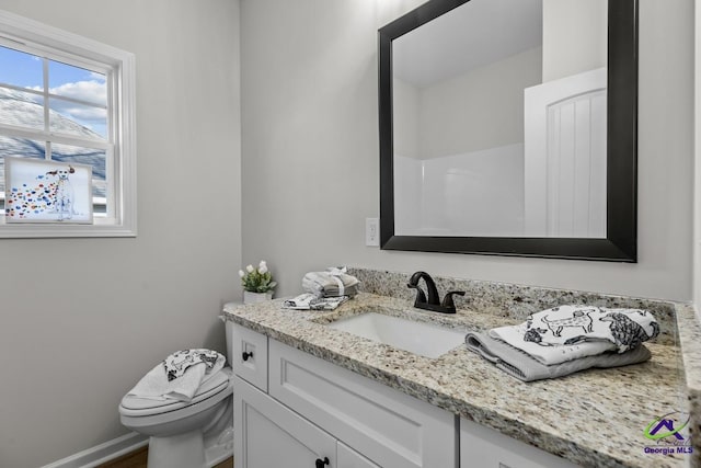 3054 Cellar Ln, Perry, GA 31069 - bathroom featuring vanity, toilet, and baseboards