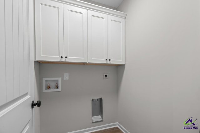 3054 Cellar Ln, Perry, GA 31069 - laundry area with cabinet space, electric dryer hookup, hookup for a washing machine, and baseboards