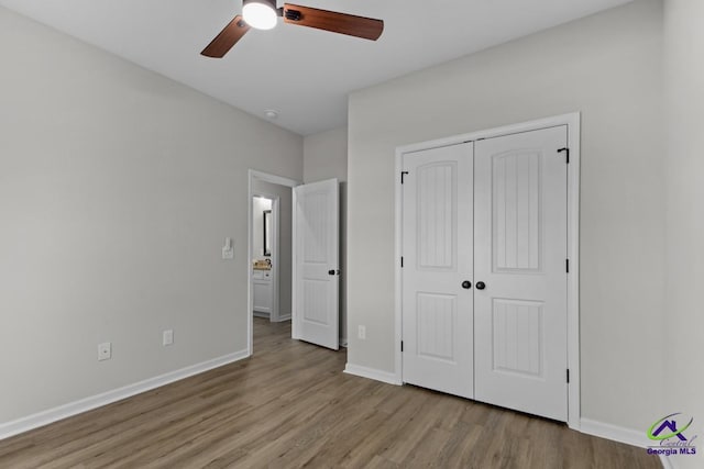 3054 Cellar Ln, Perry, GA 31069 - unfurnished bedroom featuring wood finished floors, a closet, baseboards, and ceiling fan