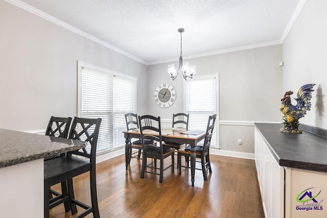 171 N Valhalla Dr, Cordele, GA 31015 - dining room featuring ornamental molding, dark wood finished floors, a chandelier, baseboards, and a textured ceiling