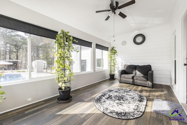 171 N Valhalla Dr, Cordele, GA 31015 - living area with healthy amount of natural light, a ceiling fan, wood finished floors, baseboards, and wooden walls