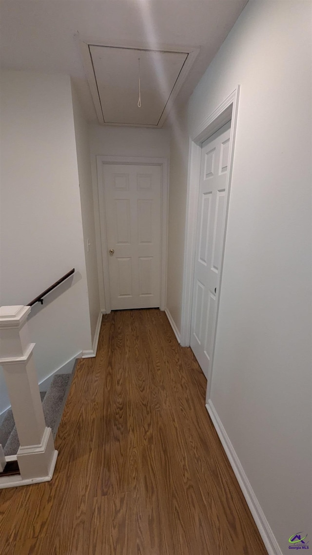 107 Whitney Ct, Warner Robins, GA 31088 - hall featuring attic access, wood finished floors, baseboards, and an upstairs landing