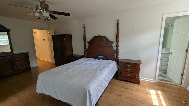 107 Whitney Ct, Warner Robins, GA 31088 - bedroom featuring wood finished floors, a ceiling fan, connected bathroom, and a textured ceiling