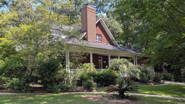 107 Whitney Ct, Warner Robins, GA 31088 - view of front of property featuring a chimney, covered porch, a front yard, and brick siding