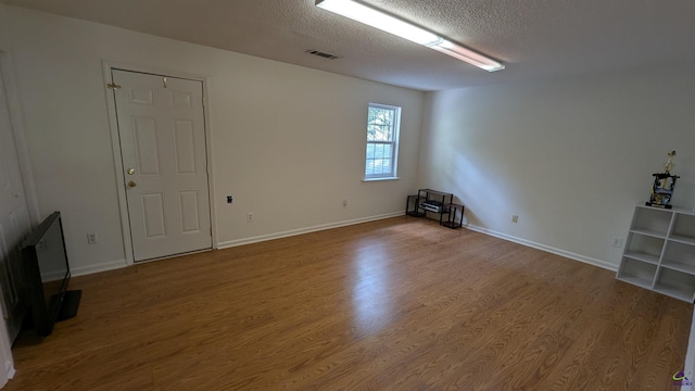 107 Whitney Ct, Warner Robins, GA 31088 - empty room featuring a textured ceiling, wood finished floors, and baseboards