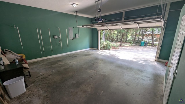 107 Whitney Ct, Warner Robins, GA 31088 - garage with baseboards and a garage door opener