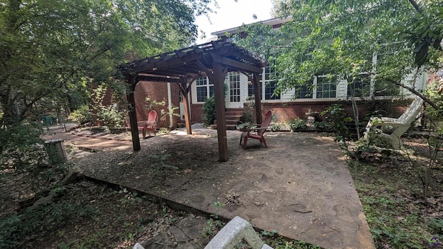 107 Whitney Ct, Warner Robins, GA 31088 - rear view of property featuring a pergola, brick siding, and a patio area
