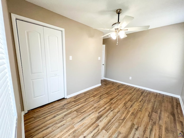 109 Stoneridge Dr, Warner Robins, GA 31088 - unfurnished bedroom featuring wood finished floors, a closet, baseboards, and ceiling fan