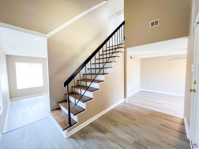109 Stoneridge Dr, Warner Robins, GA 31088 - stairway featuring wood finished floors, baseboards, and ornamental molding