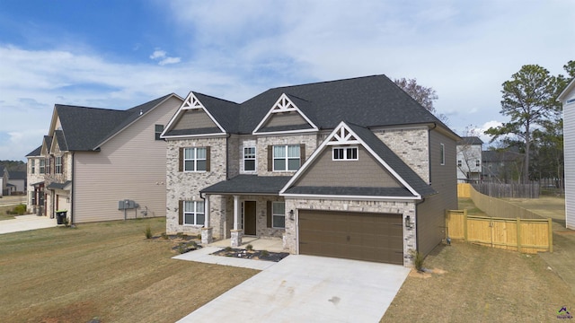 303 Garnet Dr, Bonaire, GA 31005 - craftsman-style house with concrete driveway, a garage, and a shingled roof