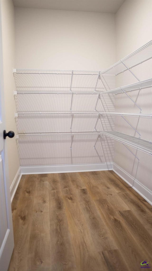 303 Garnet Dr, Bonaire, GA 31005 - walk in closet featuring wood finished floors