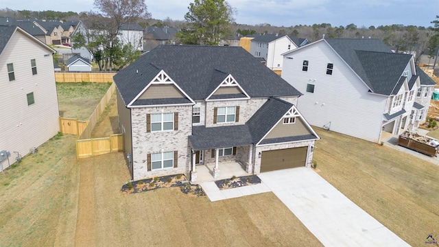 303 Garnet Dr, Bonaire, GA 31005 - craftsman inspired home with a residential view, concrete driveway, and a shingled roof