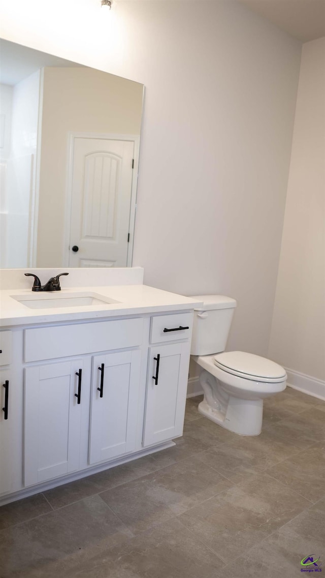 303 Garnet Dr, Bonaire, GA 31005 - half bathroom featuring vanity, toilet, and baseboards
