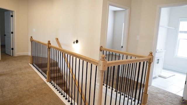 303 Garnet Dr, Bonaire, GA 31005 - hall featuring an upstairs landing, carpet flooring, and baseboards