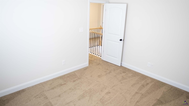 303 Garnet Dr, Bonaire, GA 31005 - carpeted empty room with baseboards
