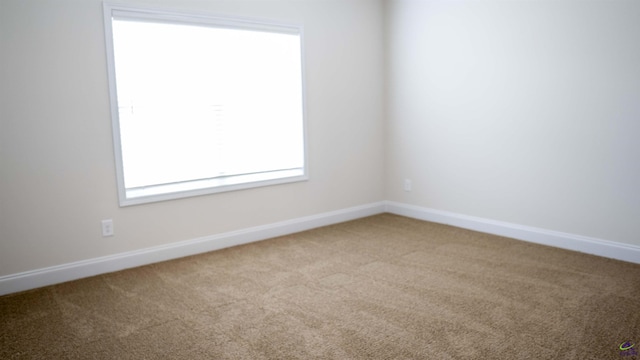 303 Garnet Dr, Bonaire, GA 31005 - carpeted empty room featuring baseboards