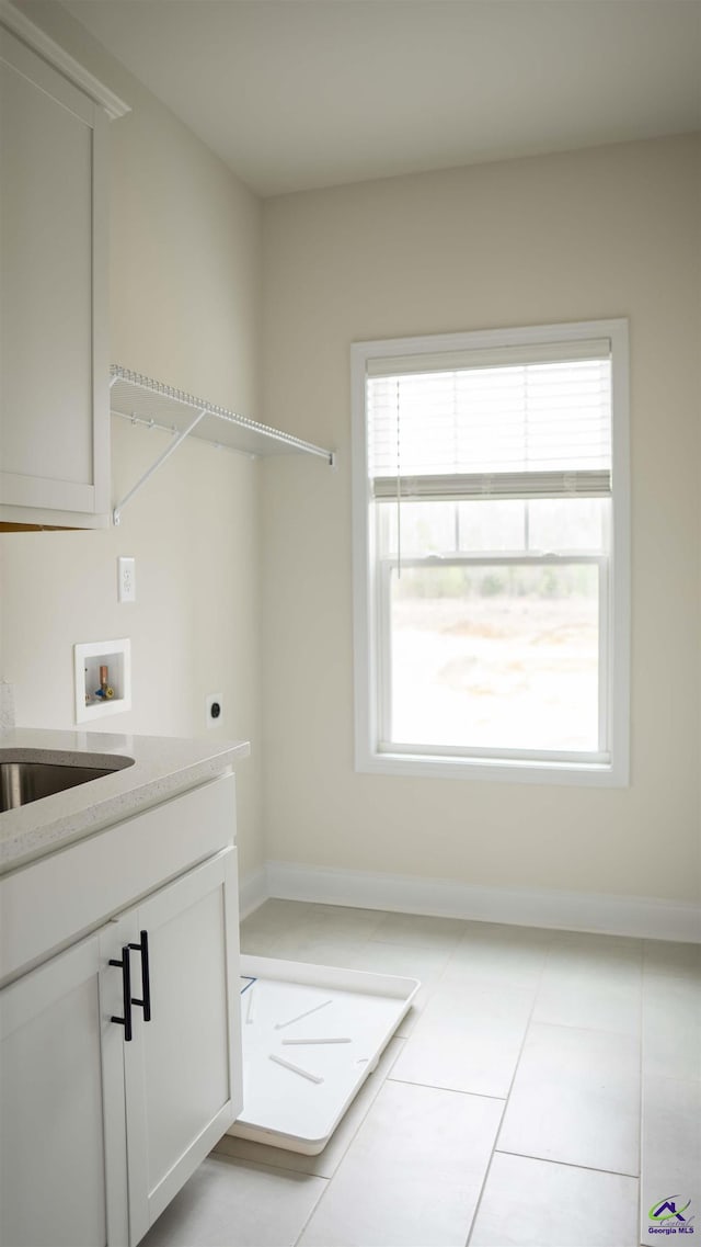 303 Garnet Dr, Bonaire, GA 31005 - laundry area featuring hookup for an electric dryer, hookup for a washing machine, and healthy amount of natural light