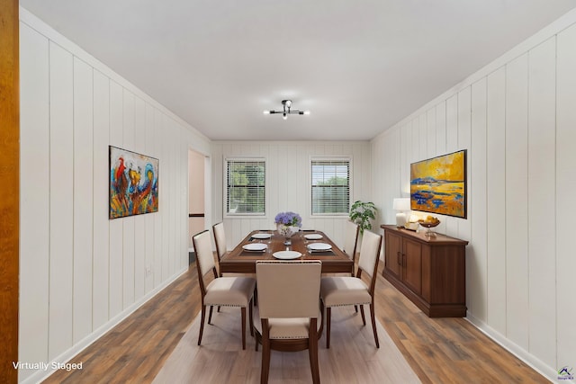 207 Oak Forest Ln, Warner Robins, GA 31088 - dining area featuring wood finished floors, baseboards, crown molding, and wooden walls