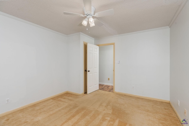 207 Oak Forest Ln, Warner Robins, GA 31088 - empty room featuring carpet, ceiling fan, crown molding, a textured ceiling, and baseboards